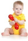 Baby with toy rattle