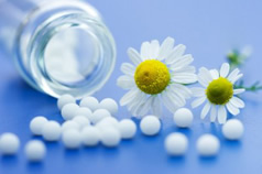 Tablets, tablet bottle and some daisies